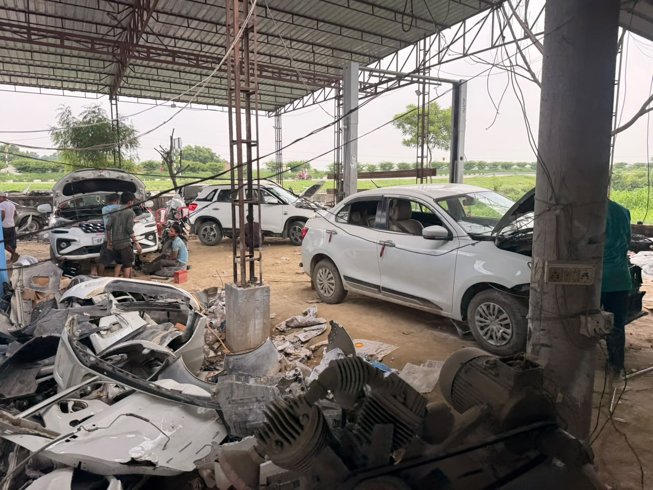 Car denting and painting work in progress at Lucky Automobile Workshop